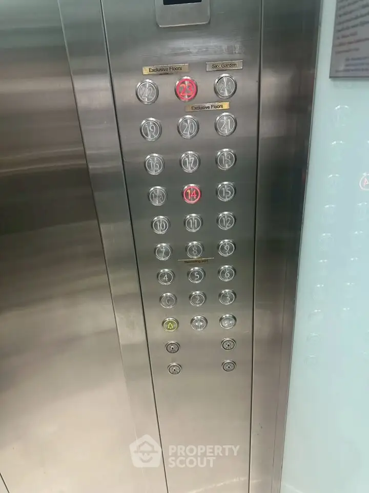 Modern elevator panel with multiple floor buttons in a high-rise building.