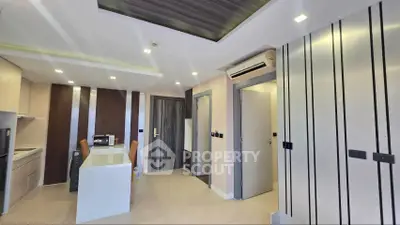 Modern kitchen with sleek design and integrated appliances in a contemporary apartment.