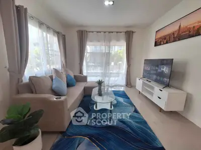 Modern living room with stylish decor and large windows for natural light