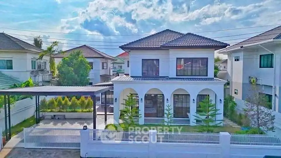 Stunning two-story house with modern design and spacious garden in a serene neighborhood.