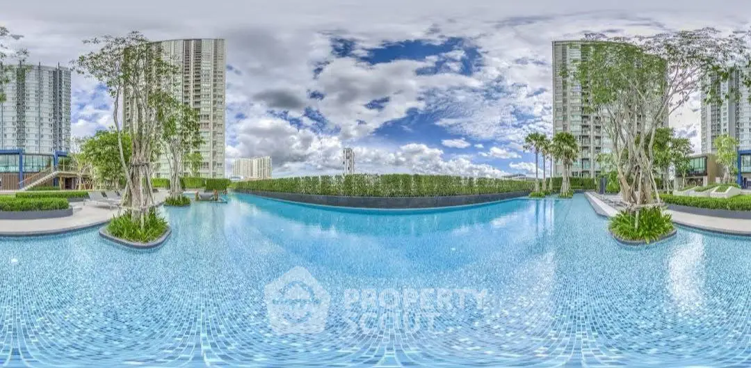 Luxurious infinity pool with stunning skyline views in modern high-rise complex.