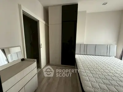 Modern bedroom with sleek wardrobe and comfortable bed in stylish apartment