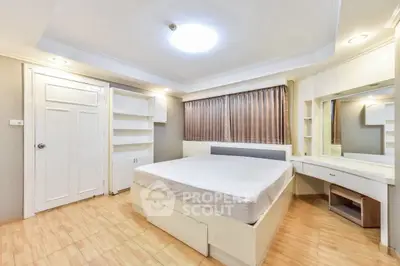 Spacious bedroom with modern design and ample storage in prime location