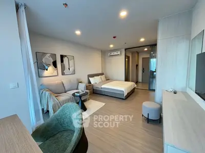 Modern studio apartment with cozy living area and stylish decor