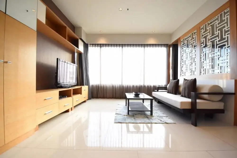 Spacious modern living room with large windows and elegant decor
