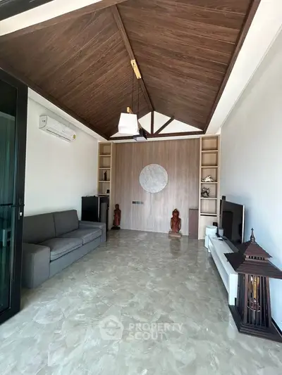 Elegant living room with high wooden ceiling and modern decor