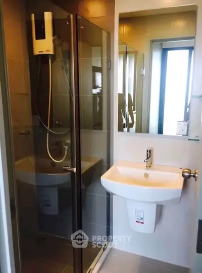 Modern bathroom with glass shower and sleek sink design