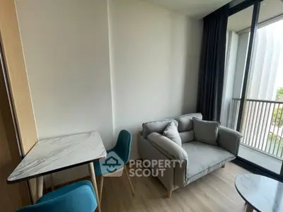 Modern living room with cozy sofa and balcony view