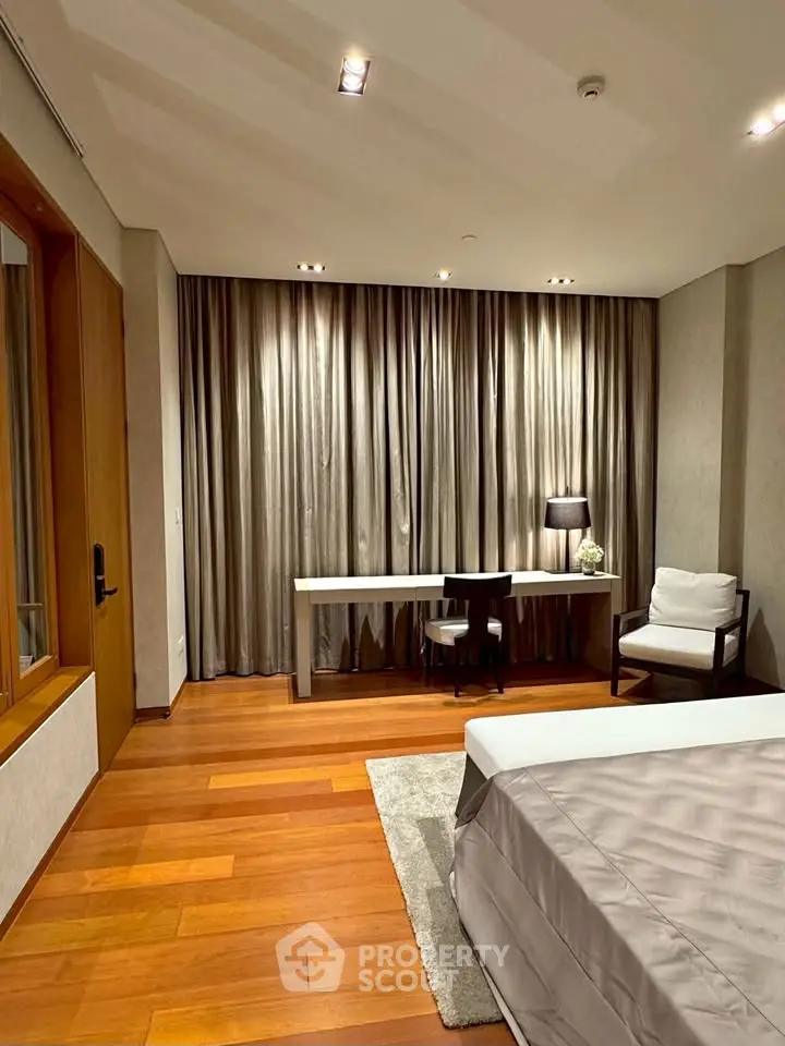 Luxurious bedroom with elegant wooden flooring and stylish decor