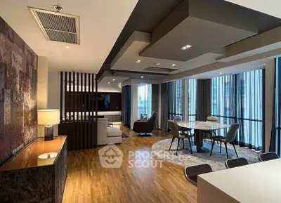 Luxurious modern living room with elegant dining area and floor-to-ceiling windows