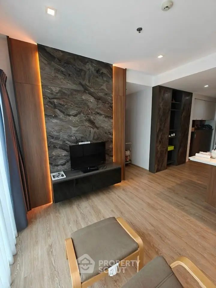 Modern living room with stylish wood paneling and TV setup