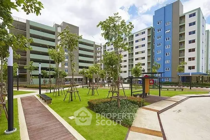 Modern apartment complex with landscaped garden and walkways