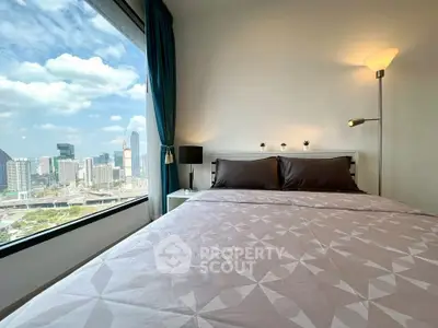 Modern bedroom with stunning city view from large window
