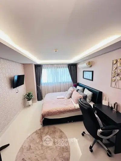 Modern bedroom with stylish decor, featuring a cozy bed, wall-mounted TV, and elegant lighting.