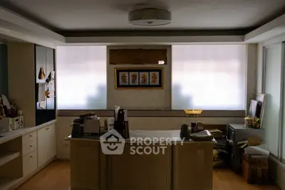 Cozy home office with ample storage and natural light, ideal for productivity.