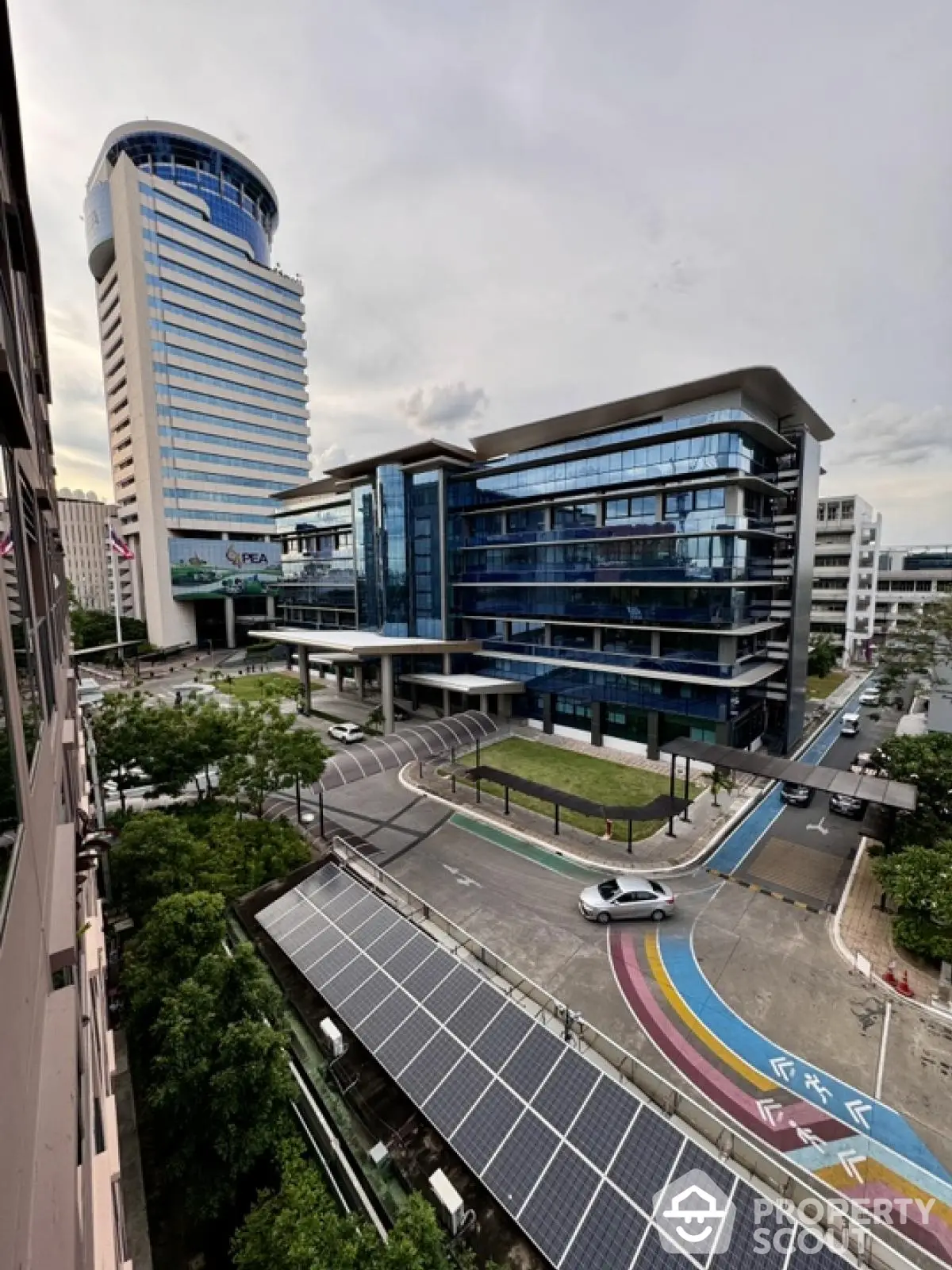 Modern office building with sleek glass facade and urban surroundings