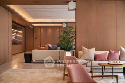 Luxurious modern living room with elegant furniture and warm lighting.