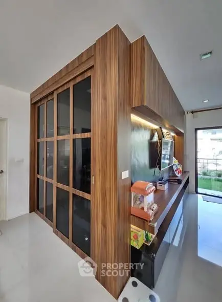 Modern interior with wooden accents and sleek design, featuring a stylish storage unit.