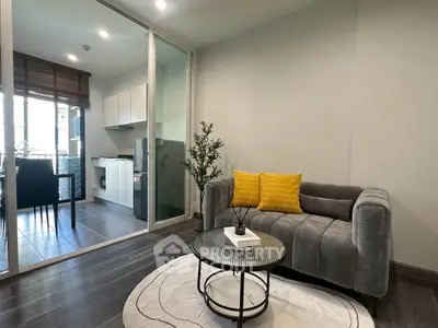 Modern living room with stylish decor and open kitchen layout
