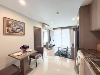 Modern open-plan living room with dining area and kitchen in stylish apartment