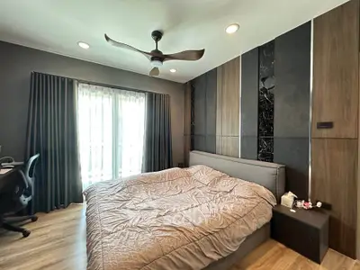 Modern bedroom with stylish decor and large window for natural light