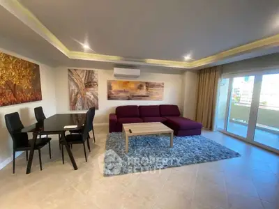 Spacious living room with modern decor and large windows for natural light