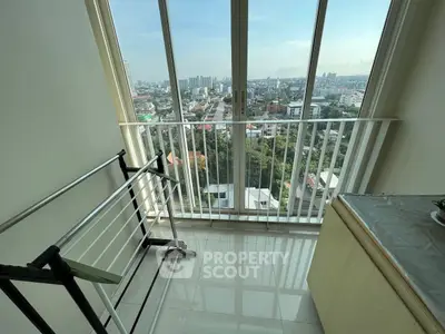 Stunning high-rise balcony with panoramic city views and sleek modern design.