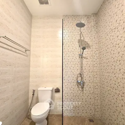 Modern bathroom with stylish shower and elegant tile design