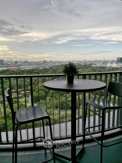 Stunning balcony view with cityscape and lush greenery, perfect for relaxation and enjoying the skyline.