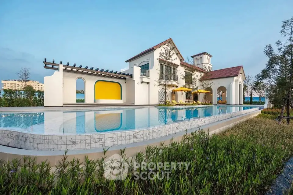 Luxurious villa with infinity pool and lush garden, showcasing elegant architecture and serene surroundings.