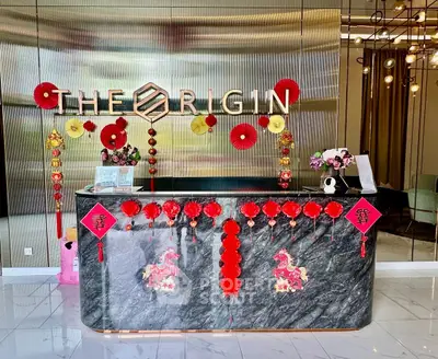 Elegant real estate lobby with festive decorations and modern design elements.