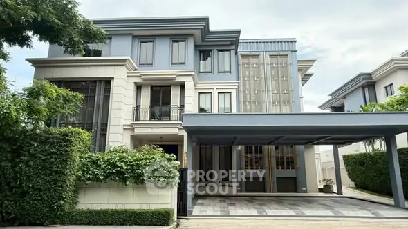 Luxurious modern house with spacious driveway and elegant facade