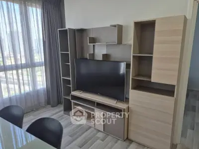 Modern living room with stylish TV stand and natural light
