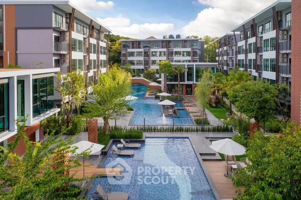Luxurious apartment complex with stunning pool and lush landscaping