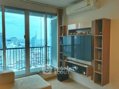 Modern living room with city view, large windows, and stylish entertainment center.