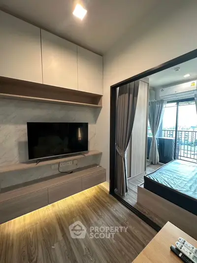 Modern living room with sleek design and balcony view