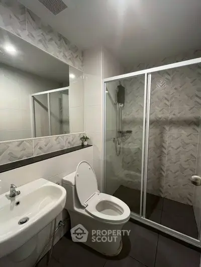 Modern bathroom with sleek shower enclosure and stylish tile design