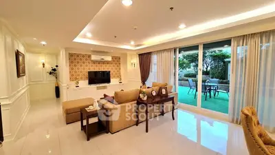 Luxurious living room with elegant decor and garden view, perfect for relaxation and entertainment.