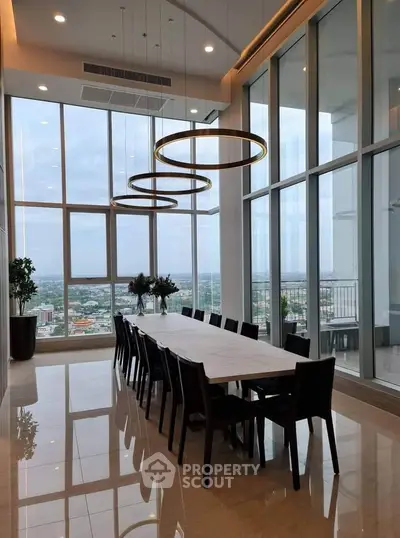 Luxurious dining area with floor-to-ceiling windows offering stunning city views.
