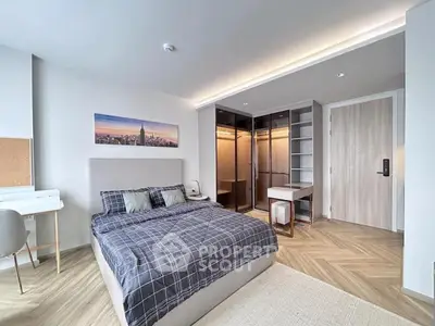 Spacious modern bedroom with stylish decor and walk-in closet