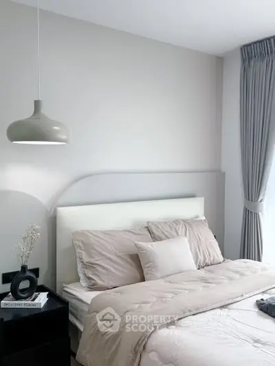 Modern bedroom with elegant decor and natural light