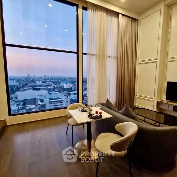 Luxurious high-rise living room with stunning city view and elegant decor.