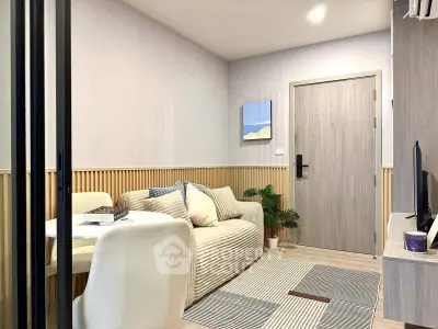 Cozy modern living room with stylish decor and comfortable seating, perfect for relaxation and entertainment.