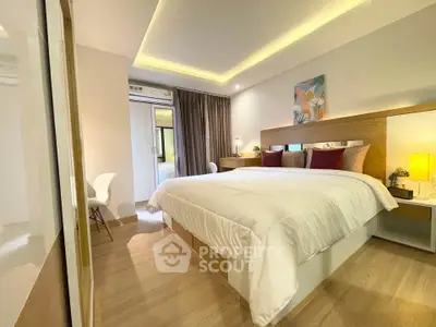 Modern bedroom with stylish decor and cozy lighting, featuring a comfortable bed and elegant furnishings.