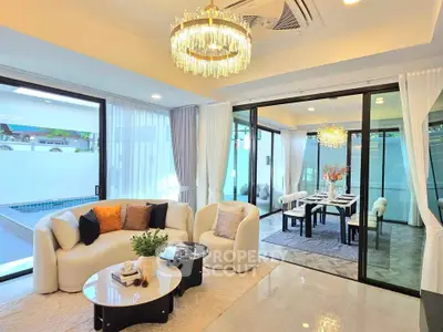 Luxurious living room with elegant decor and pool view