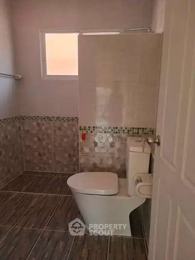Modern bathroom with stylish tile design and natural light