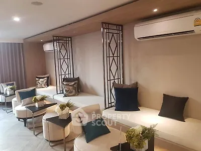 Stylish modern living room with elegant seating and air conditioning