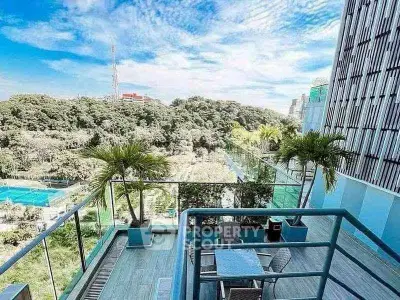 Luxurious balcony with stunning city and park views, perfect for relaxation and entertainment.