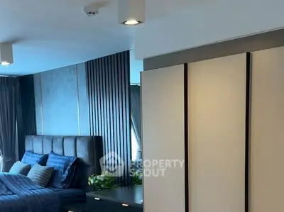 Luxurious bedroom with modern decor and elegant lighting