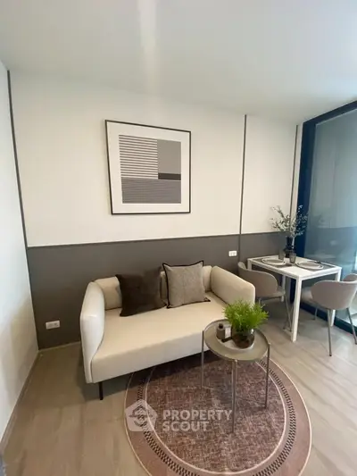 Modern living room with stylish decor and cozy seating area, perfect for relaxation and entertaining.